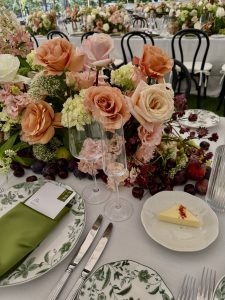 Sailcloth tent wedding on the Hudson River with locally sourced flowers, black bentwood chairs, and a black-and-white checkered dance floor.